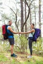 Happy hikers holding hands looking at camera Royalty Free Stock Photo