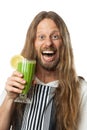 Happy hippie drinking a green vegetable smoothie