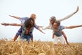 Happy hippie friends having fun on cereal field Royalty Free Stock Photo