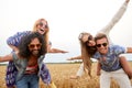 Happy hippie friends having fun on cereal field Royalty Free Stock Photo