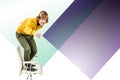 Composite image of happy hipster businessman standing on his chair Royalty Free Stock Photo