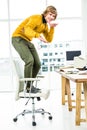 Happy hipster businessman standing on his chair Royalty Free Stock Photo