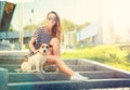 Happy Hipster Girl with her Dog in the City Royalty Free Stock Photo