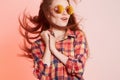 Happy hipster girl in sunglasses