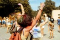 Happy hipster girls having fun with colorful powder at holi fest