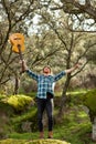 Happy hipster man with a guitar in the field Royalty Free Stock Photo