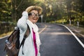 Happy hipster old women backpack traveling on the road relax time and holiday Royalty Free Stock Photo