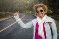 Happy hipster old women backpack traveling on the road relax time and holiday Royalty Free Stock Photo