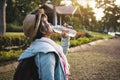 Happy hipster old women drinking water of bottle during backpack Royalty Free Stock Photo