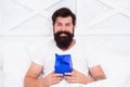 Happy hipster with present box. early morning surprise. start day with birthday greeting. gift for spent night. bearded Royalty Free Stock Photo