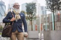 Happy hipster senior business man walking to work - Focus on face Royalty Free Stock Photo
