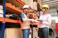 Happy Hispanic Coworkers Agreeing After Discussion At Warehouse