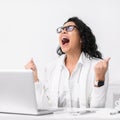 Happy hispanic girl yelling at work place Royalty Free Stock Photo