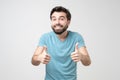 Happy hispanic man with thumbs up gesture