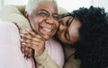 Happy Hispanic mother and daughter having tender moment together