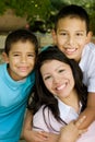 Happy Hispanic mother and her sons.