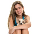 Happy hispanic teenage girl with her small dog Royalty Free Stock Photo