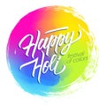 Happy Holi Indian spring festival of colors circle brush stroke colorful background with handwritten holiday greetings. Royalty Free Stock Photo