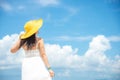 Happy Holiday and Summer. Asian woman wearing white dress and yellow big hat fashion summer Royalty Free Stock Photo