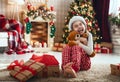 Child opening Christmas present Royalty Free Stock Photo