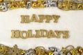 Happy holidays golden text and Christmas decorations on a white Royalty Free Stock Photo