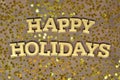Happy holidays golden text and golden stars