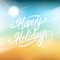 Happy Holidays greeting card. Hand drawn lettering text design on blurred summer beach background. Royalty Free Stock Photo