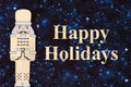 Happy Holidays message with gold nutcrackers Royalty Free Stock Photo