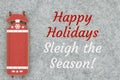 Happy Holidays message with red and white winter sled