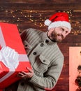 Happy holidays. Santa Claus. Smiling guy with giant gift box. I am here to give present. Delivering happiness to your Royalty Free Stock Photo