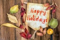 Happy holidays text with autumn theme Royalty Free Stock Photo