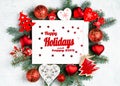 Happy Holidays and happy 2019 text with Christmas photoframe surrounded by branches of a New Year tree, red Christmas decorations Royalty Free Stock Photo