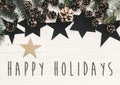 Happy Holidays text on modern christmas flat lay with green fir Royalty Free Stock Photo