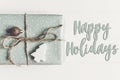 Happy holidays text, seasonal greetings card sign. modern christ