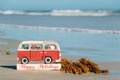 Happy Holidays VW bus sign on the shores of New Smyrna Beach, Florida