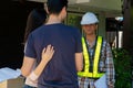 Happy homeowner stand in front of contractor and shake hand, handyman holding clipboard and after checking details before Royalty Free Stock Photo