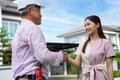 Happy homeowner stand in front of contractor and shake hand, handyman holding clipboard and after checking details before Royalty Free Stock Photo