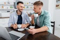 happy homosexual couple holding coffee near Royalty Free Stock Photo