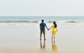 Happy honeymoon vacation at Lakshadweep, India. Indian couple relax on the white sand of beach. Happy sea lifestyle. Young family Royalty Free Stock Photo