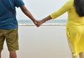 Happy honeymoon vacation at Lakshadweep, India. Indian couple relax on the white sand of beach. Happy sea lifestyle. Young family Royalty Free Stock Photo