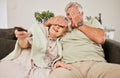Happy, horror and watching tv with old couple on sofa for streaming, subscription and movie. Fear, television and scared Royalty Free Stock Photo