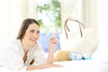 Happy hotel guest pointing at side on vacations