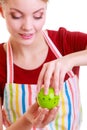 Happy housewife or chef in kitchen apron using apple timer Royalty Free Stock Photo
