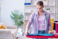 The happy housewife doing ironing at home Royalty Free Stock Photo