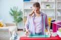 The happy housewife doing ironing at home Royalty Free Stock Photo