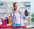 The happy housewife doing ironing at home Royalty Free Stock Photo