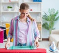 Happy housewife doing ironing at home Royalty Free Stock Photo