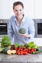 Happy housewife preparing dinner