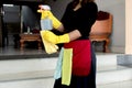 Happy housewives in rubber gloves with dust-wiping equipment, aerosol cleaners ready cleaning. concept do housework Royalty Free Stock Photo