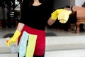 Happy housewives in rubber gloves with dust-wiping equipment, aerosol cleaners ready cleaning. concept do housework Royalty Free Stock Photo